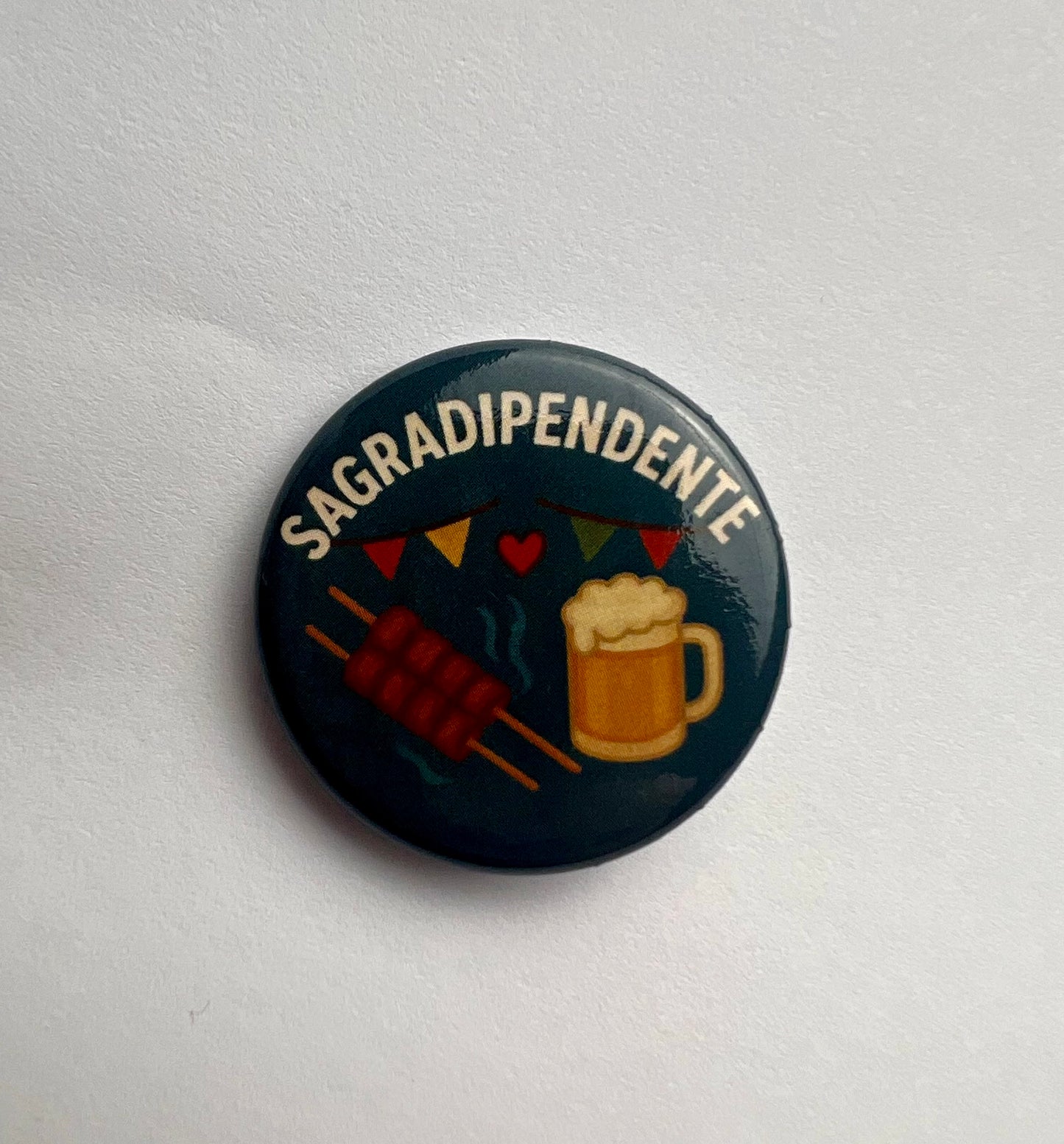 Spilla “Sagradipendente” color ottanio